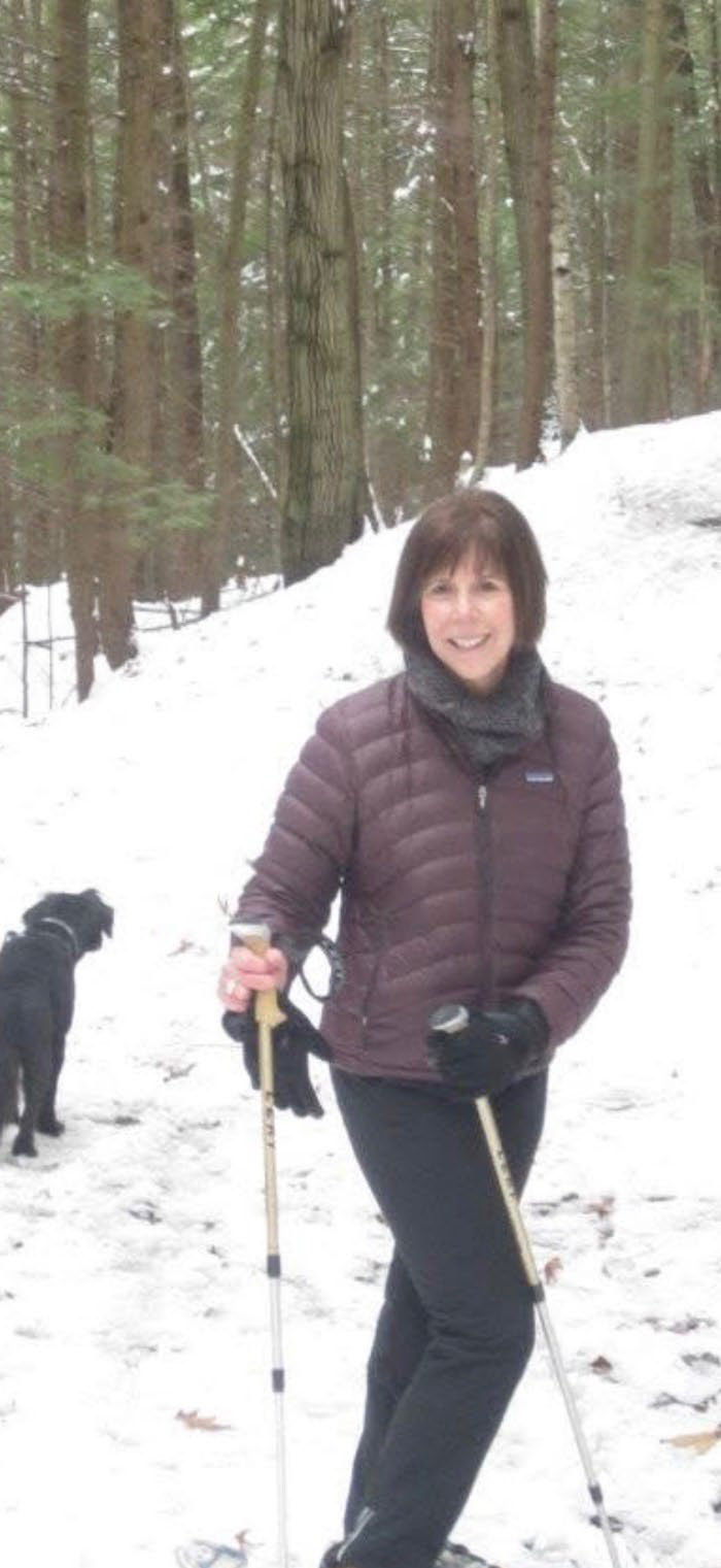 Betsy Lewis, smiling outdoors